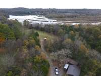 Property is over 5 acres with approximately 2 acres of Corps of Engineer land touching the water