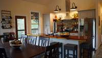 Open kitchen with cedar counter tops and island