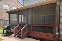 Take a break from the heat in this fabulous screened in porch!