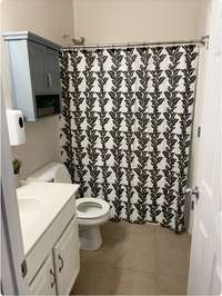 Full bath downstairs connects to bedroom