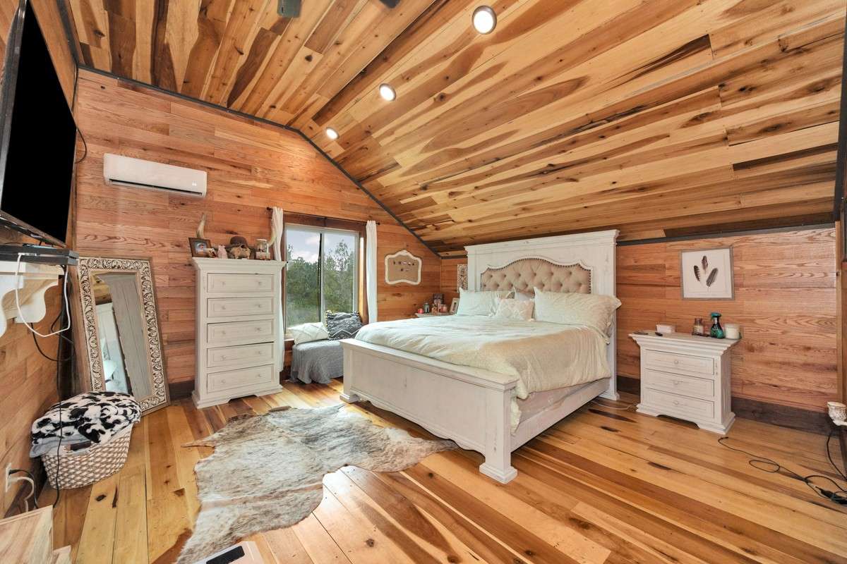Bedroom #2- upstairs, poplar wood flooring, hickory walls, recessed lighting
