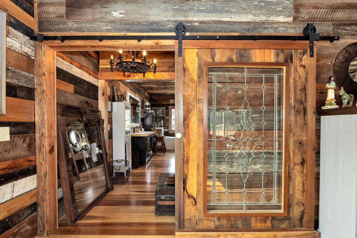 Main floor- custom barn door from Master bedroom to master Bath