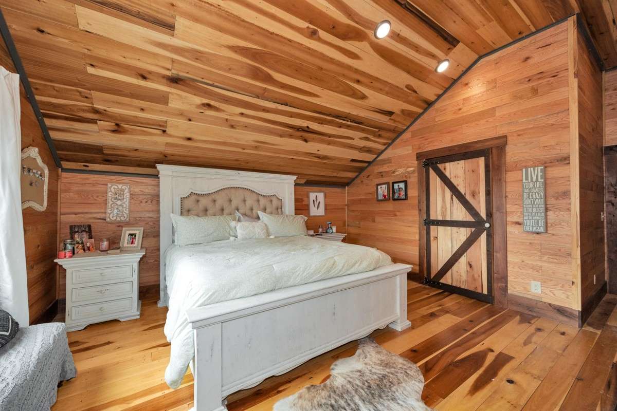Bedroom #2- upstairs, poplar wood flooring, hickory walls, recessed lighting