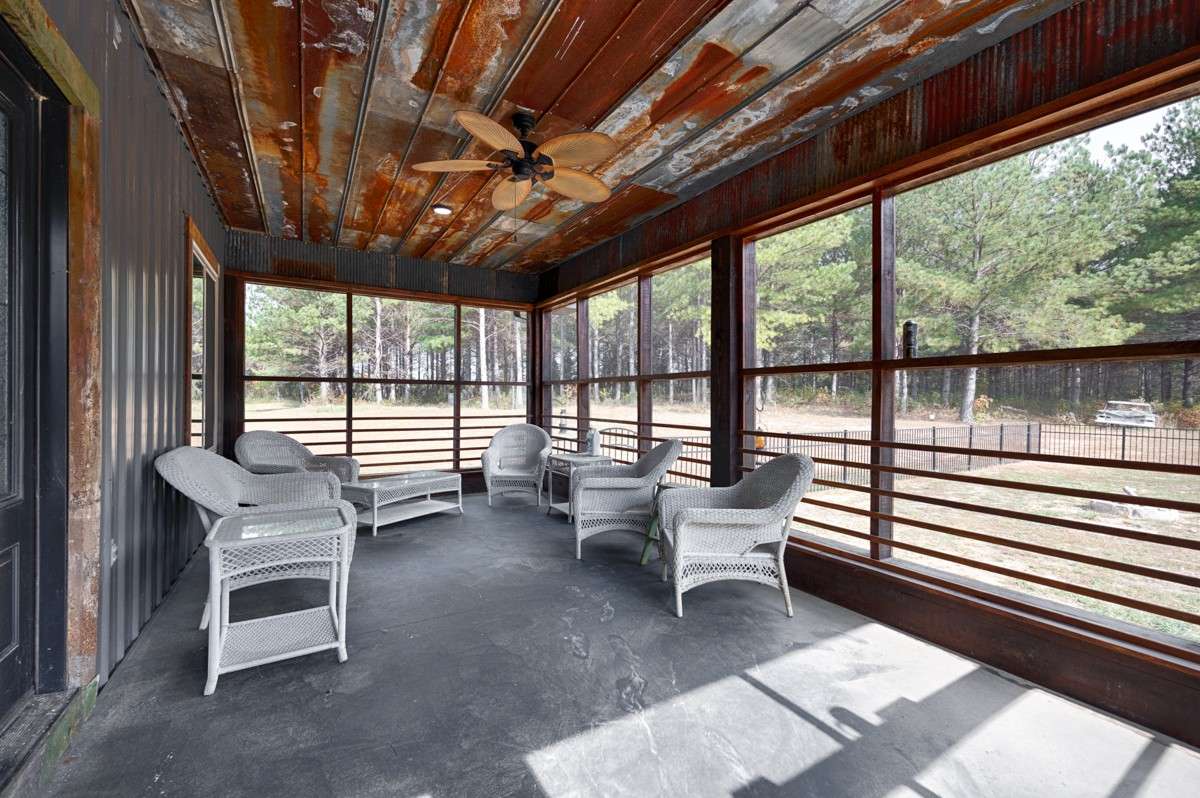 Screened porch - metal ceiling, ceiling fan, great view of the gated pool area