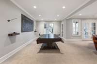 lower level bonus room with walk out covered patio and yard