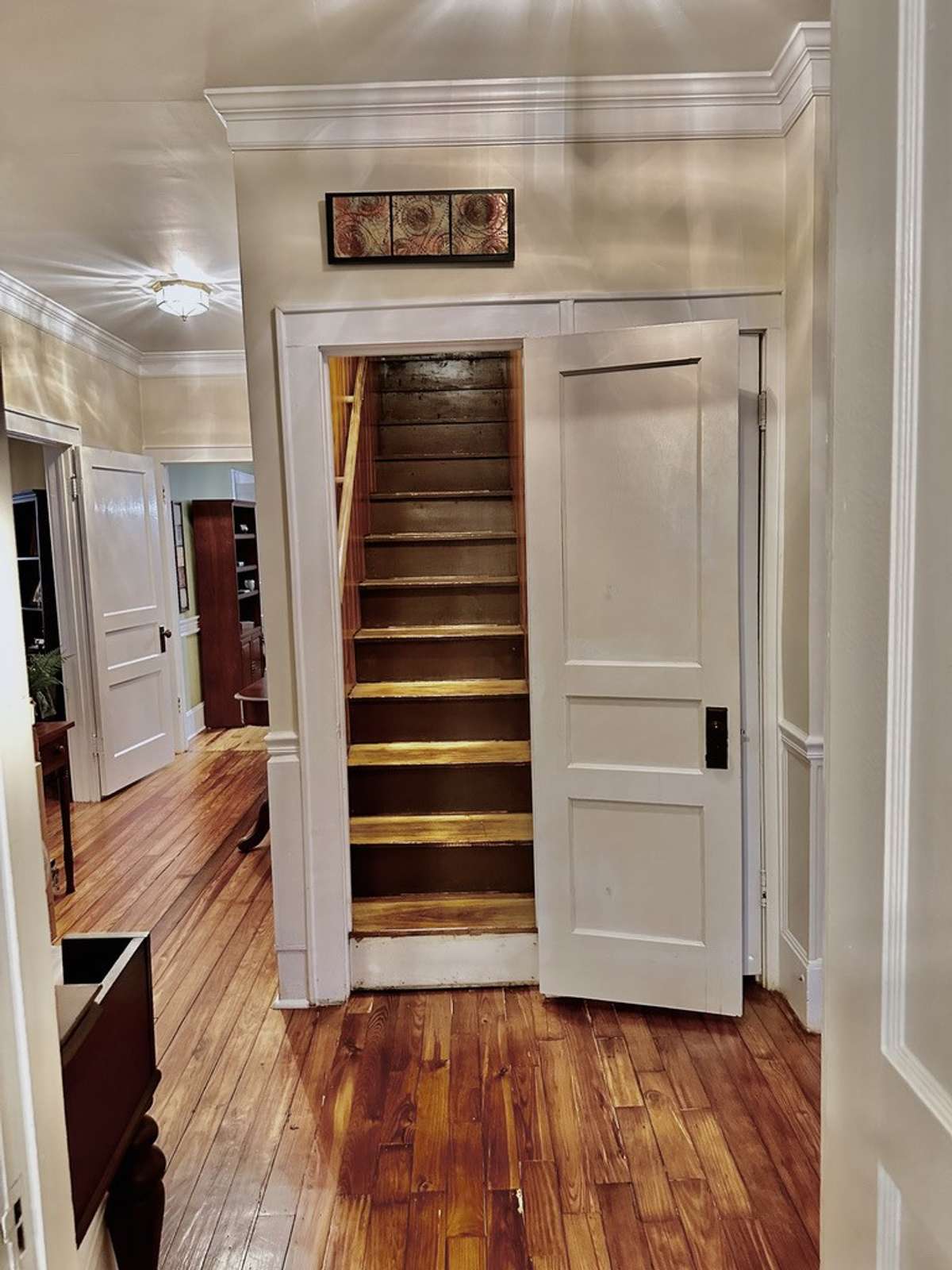 Staircase leading up to 2nd story. Offers a doorway therefore heat & air can be controlled.