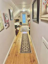 Hallway leading to upstairs bedroom.