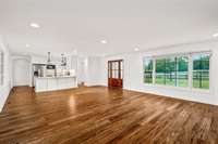 Complete open-concept floor plan seamlessly connects living room, kitchen, and breakfast nook. Expansive front and rear windows offer unparalleled views of the property and lake from every vantage point.