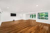 Complete open-concept floor plan seamlessly connects living room, kitchen, and breakfast nook. Expansive front and rear windows offer unparalleled views of the property and lake from every vantage point.