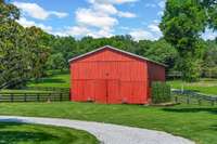 Tobacco storage pole barn perfect for equipment storage, featuring wide access, open-span interior, and durable construction—ideal for farm use or additional utility space.