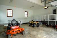 Interior of attached garage with wheelchair accessible ramp to kitchen area