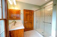 Primary bath with tile and glass shower