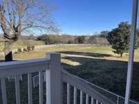View of side yard from back porch stairs
