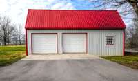 Detached garage/ storage building with large room above and exterior staircase for access