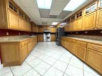Extended countertops and cabinets in lower level kitchen. Commercial hook up is accessible but not currently used