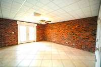 Lower level bedroom with access to covered porch