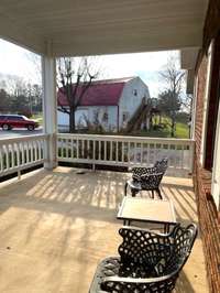 Front porch showing proximity of detached garage