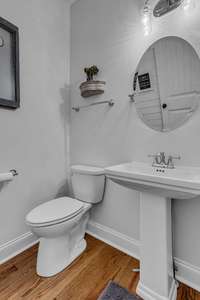 Powder room on mail level opposite kitchen.