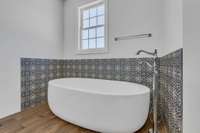 Designer Soaking tub in main bathroom.