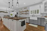 Double porcelain sink provides functionality, durability and timeless appeal in this busy kitchen.