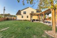 Gas fireplace on the patio as well as firepit near rear of the yard