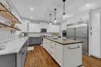 Very large refrigerator/freezer stays with the home.