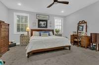 Personal and tranquil spacious main bedroom serves as the perfect retreat after a long day.