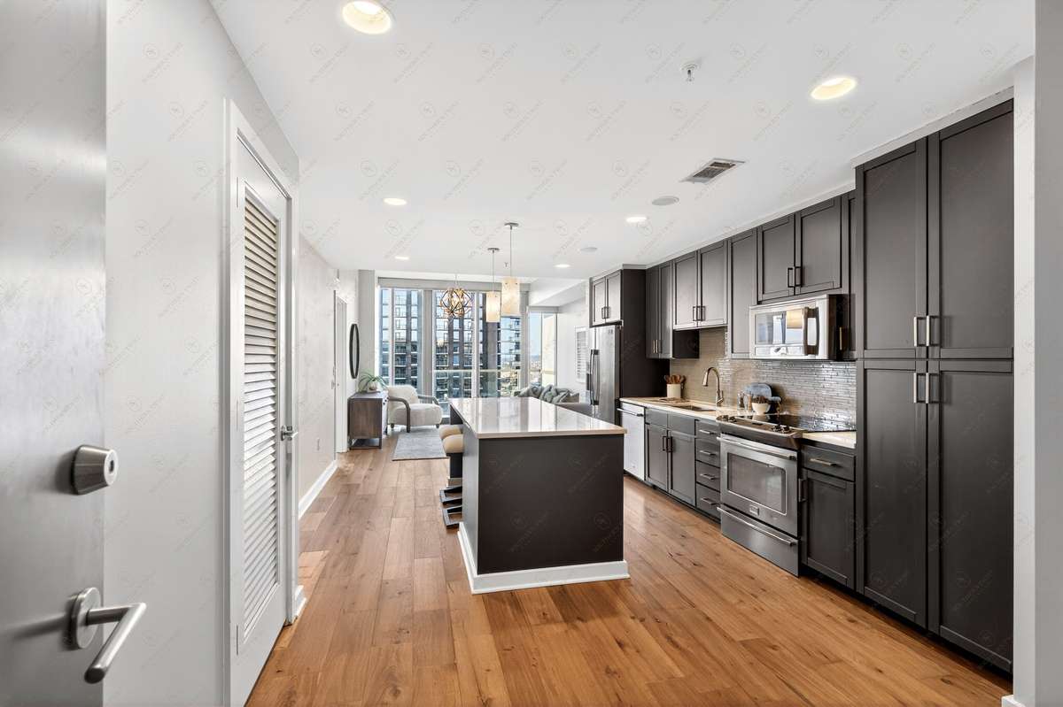 Entry into great room styled unit with new hardwood flooring (not developer grade lament)