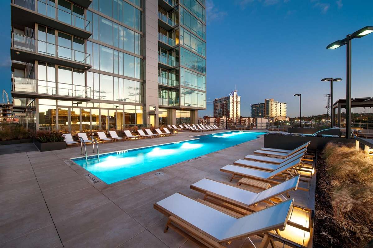 Enjoy the sun drenched gathering spaces on the spa like pool deck with saline heated pool, hot tub, fire pits and two separate grilling areas for all the summer fun you need.