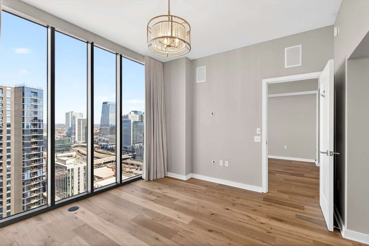 Views of unit before staging showing the pristine flooring professionally installed by this owner