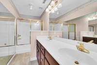 Upstairs bathroom with double vanity and enclosed Shower/Tub combination. Beside Bedroom #5