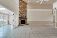 Stone fireplace all the way to the ceiling features a gas log insert to warm things up.