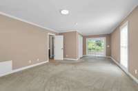 Super sized 26x14 Main level Owner's suite Bedroom #1 , features Walk in closet, laundry room, easy access to the screened in porch, private bathroom with double vanities, and jetted tub.