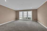 16x15 Front main level Bedroom #2 with 3 closets could be used as a bedroom or Office.