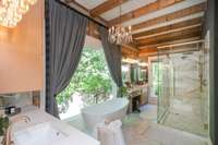 Marble floors, large frameless glass shower, dual vanities, with an incredible view!