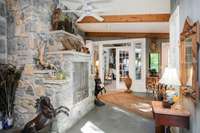 Side foyer with an indoor barbecue to the left, sunroom straight ahead in the back