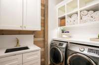 Laundry room with convenient access from the primary suite