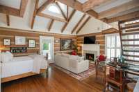 Another large bedroom on the second floor with a private porch, fireplace, renovated bath and kitchen - this room also has it's own private staircase down to the main floor.