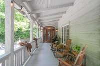One of two main entrances to the home, a favorite spot for all, on this ideal rocking chair porch