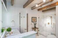 Marble tile cover the floors and shower
