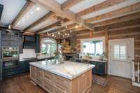 Newly expanded and renovated kitchen - double ovens, 6 burner gas fireplace, wine fridge, sub zero refrigerator, drawer microwave, quartz surfaces