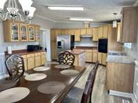 Look at all that counter and cabinet space!! Plus a built in coffee bar &/or pantry!!