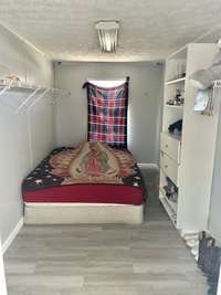 This is the primary bedroom walk in closet!! It is so big it's being used as a 4th bedroom!!