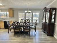 Large dining room with tons of windows for natural lighting!!