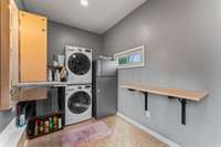 Mudroom/Utility Room featuring a built-in Ironing Board and a Fold-out Table for your laundry needs.