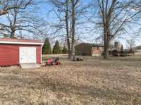 The Storage Building has a ramp and wide doorway for pulling equipment in and out of with ease.