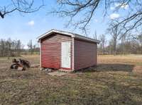 Storage Building: With 5 acres, this storage building will be the perfect place for all your outdoor needs.