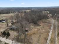 Drone Footage: This back plot of land is perfect for building a barn, horse stalls, or even a bigger home.