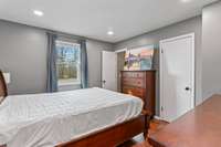 Primary Bedroom with Closet and Half Bath.