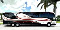 The detached garage was built to house this motor home but it's not included in the home sale.